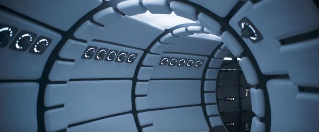 Inside of the Millenium Falcon with white padding and LED lights.