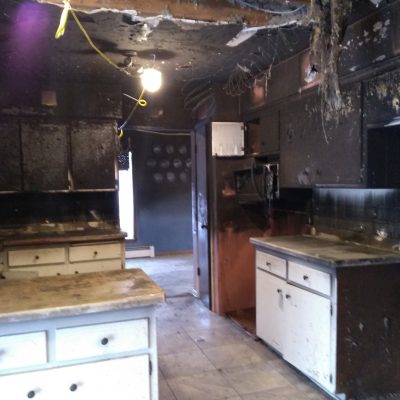 Dilapidated kitchen after sustaining fire damage in Brookfield