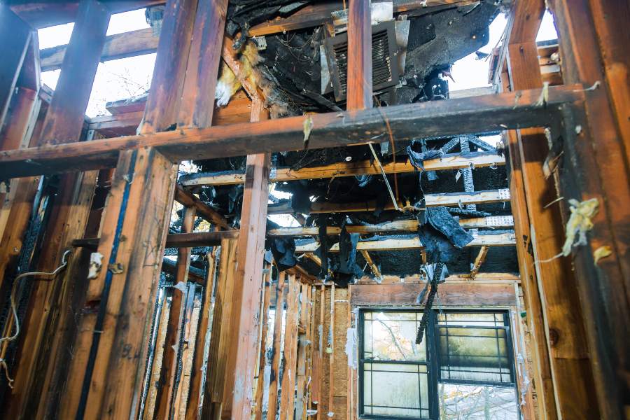 Home with exposed walls and roof damaged by fire in Wauwatosa, WI