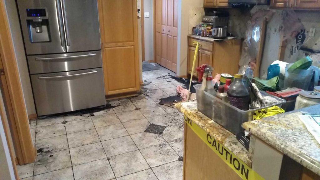 Dirty kitchen after fire damage in a property in Waukesha, WI