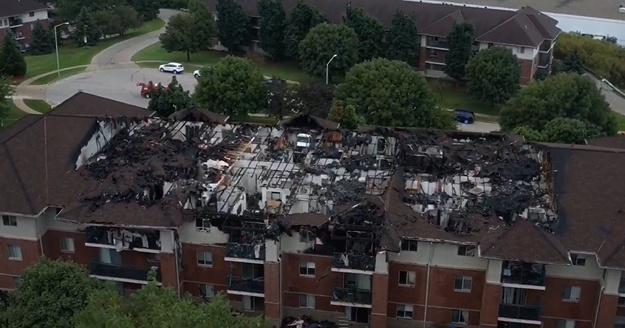 Aftermath images of significant fire damage to the apartment in Waukesha, WI