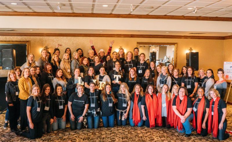 Attendees and Organizers Posing for a Group Photo at the Property Management Summit in Wauwatosa, WI