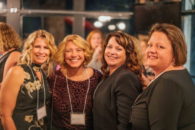 Women Posing Together During the Women in Property Management Summit in Wauwatosa, WI