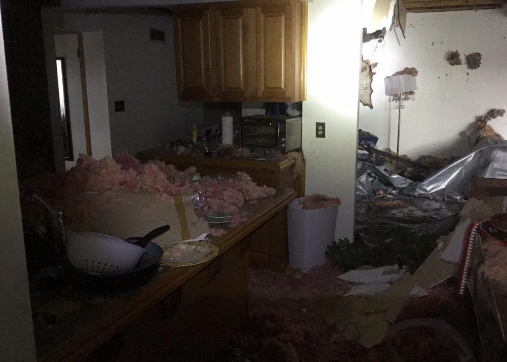 Greednale home with collapsed ceiling and exposed insulation after house fire