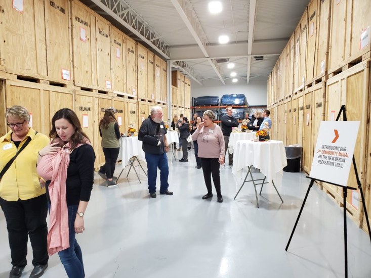 Visitors Networking at an Open House Event in the Contents Processing Center in New Berlin, WI